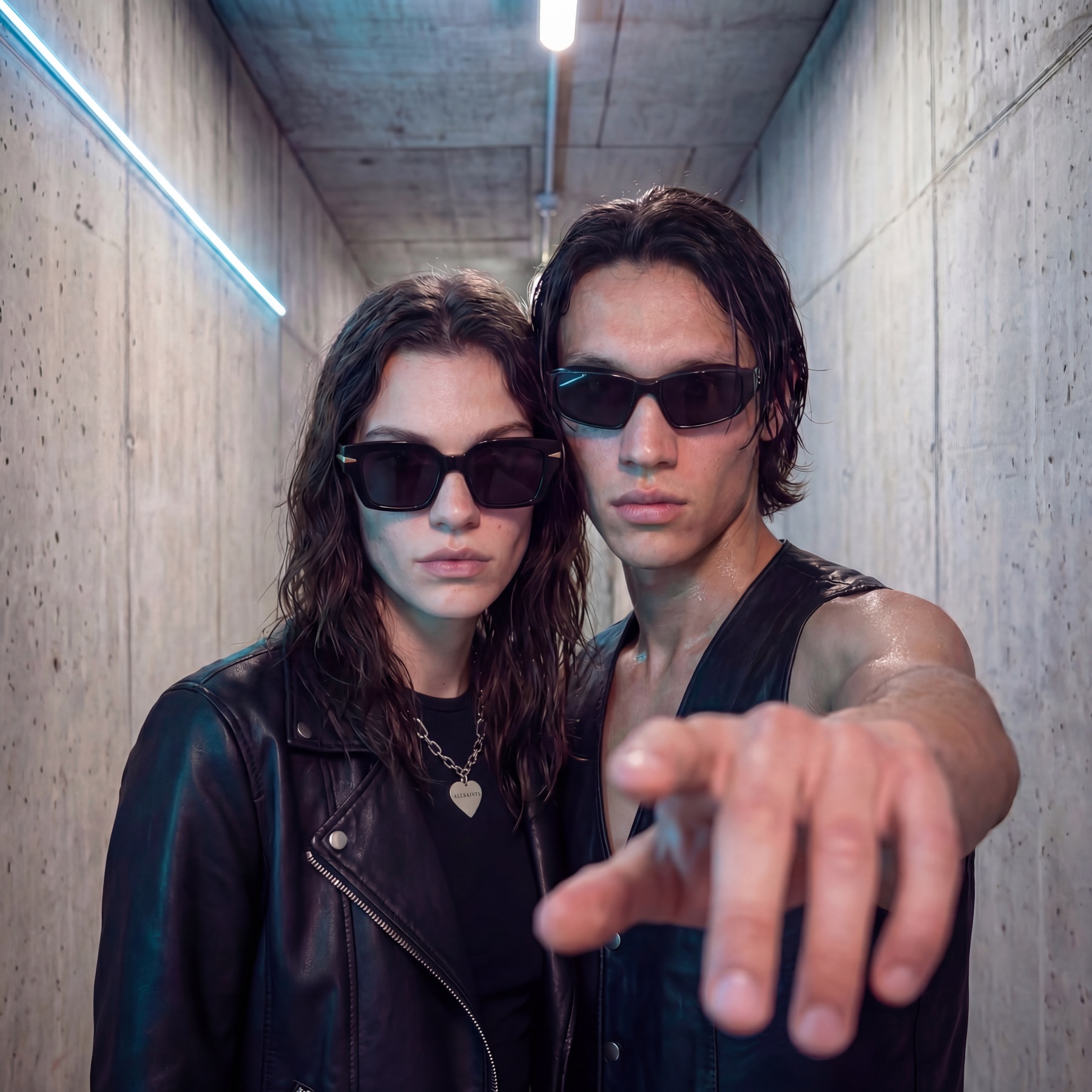 AllSaints ALIVE — couple in concrete corridor