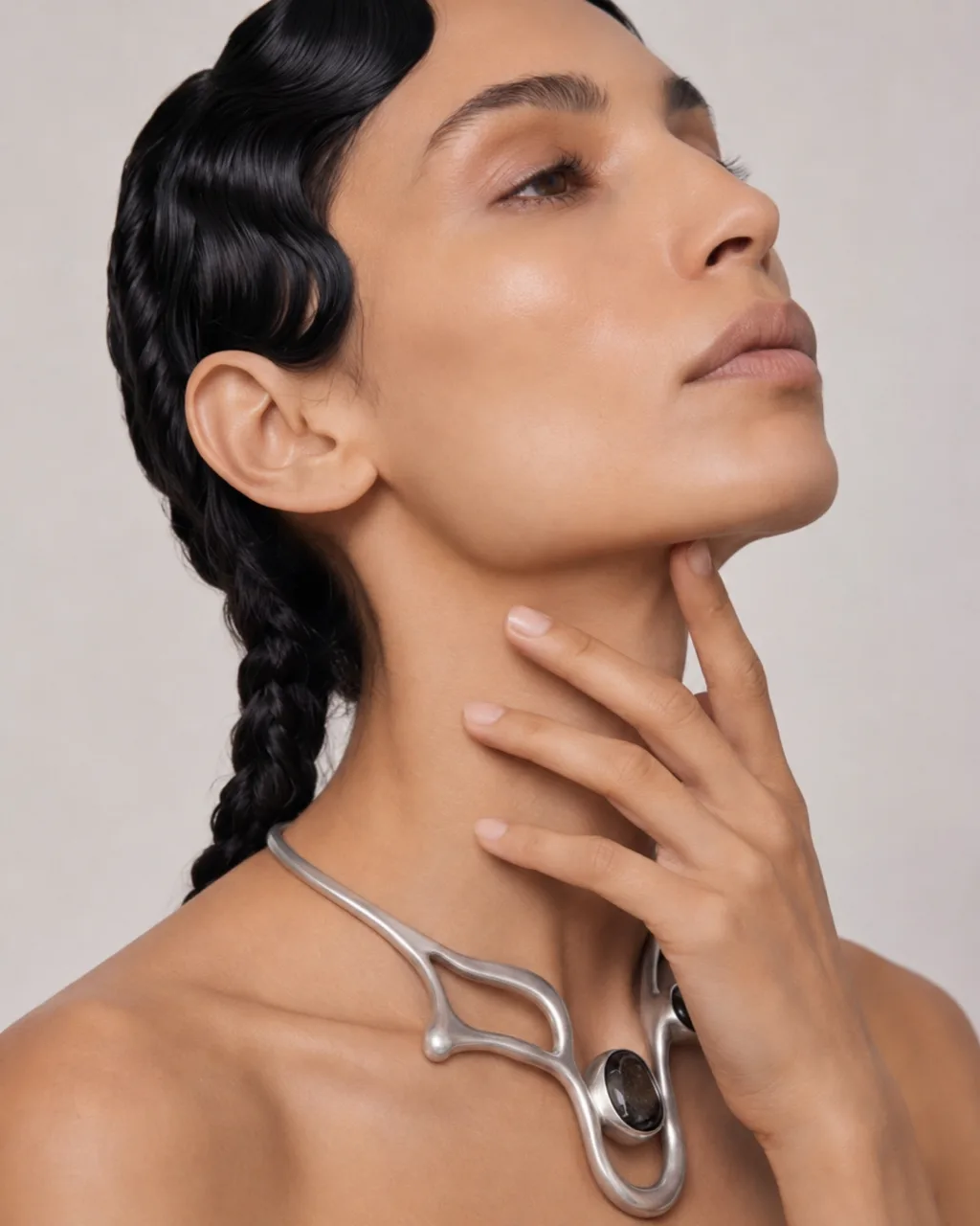 Model in profile wearing the OSSA necklace