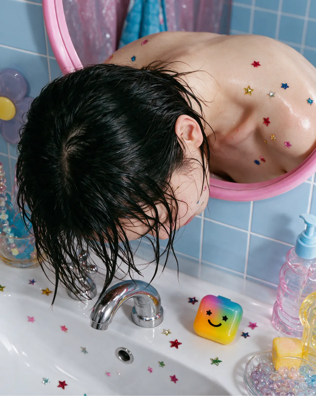 Head in a pastel sink, stars on the cheek