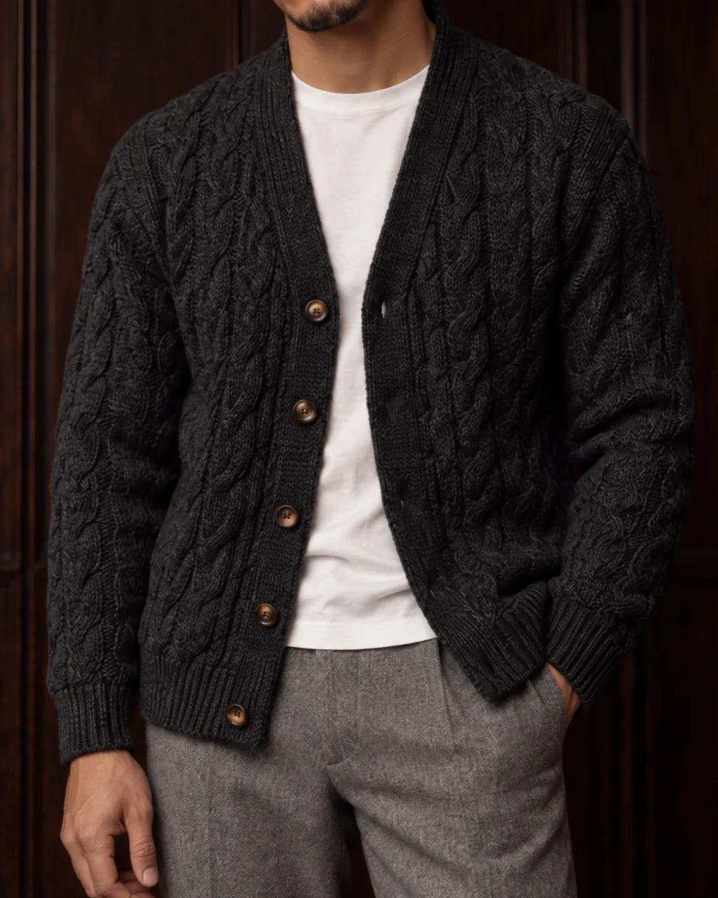 Sunderly lookbook, look 6, charcoal cable cardigan and grey flannel trousers: close crop on the fabric, AI concept work