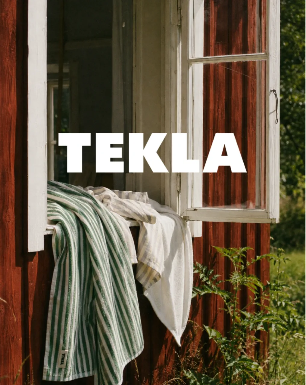 TEKLA key visual: striped towels over an open cabin window, with the TEKLA wordmark, AI concept work